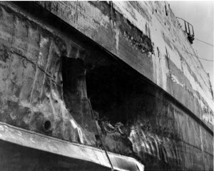 Photograph of torpedo damage below armor belt of USS
            California