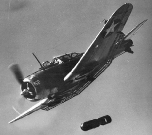 Photograph of Dauntless dive bomber dropping a bomb