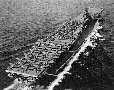 Photograph of Essex-class carrier with full deck load