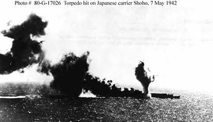 Photograph of Japanese carrier Hosho under
        attack