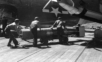 Photograph of Mark 13 torpedo with wooden entry shrouds on
        nose and tail