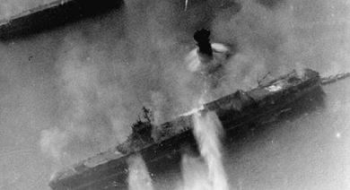 Photograph of an Unryu-class carrier under air
                attack