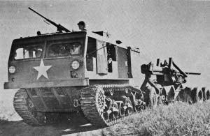 Photograph of U.S. M4 HST towing a "Long
                Tom"