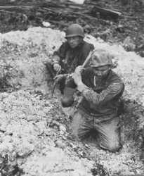 Photograph of troops attempting to entrench in coral