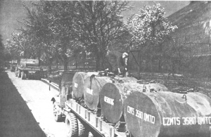 Photograph of gasoline containers being
        transported by truck