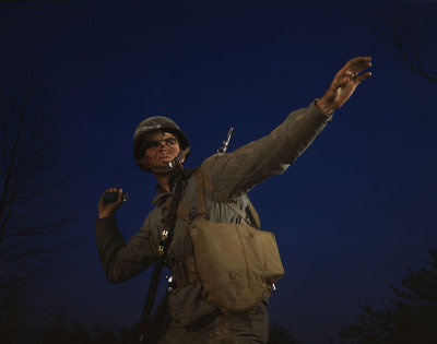 Photograph of soldier throwing grenade