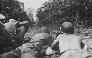 Photograph of U.S. troops advancing up the Sayre Highway outside Kabacan